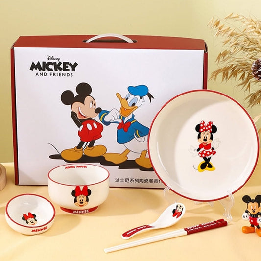 A Disney Mickey & Friends Dinnerware Set displayed, including plates, a bowl, a cup, and a spoon, featuring characters like Mickey Mouse and Minnie Mouse.