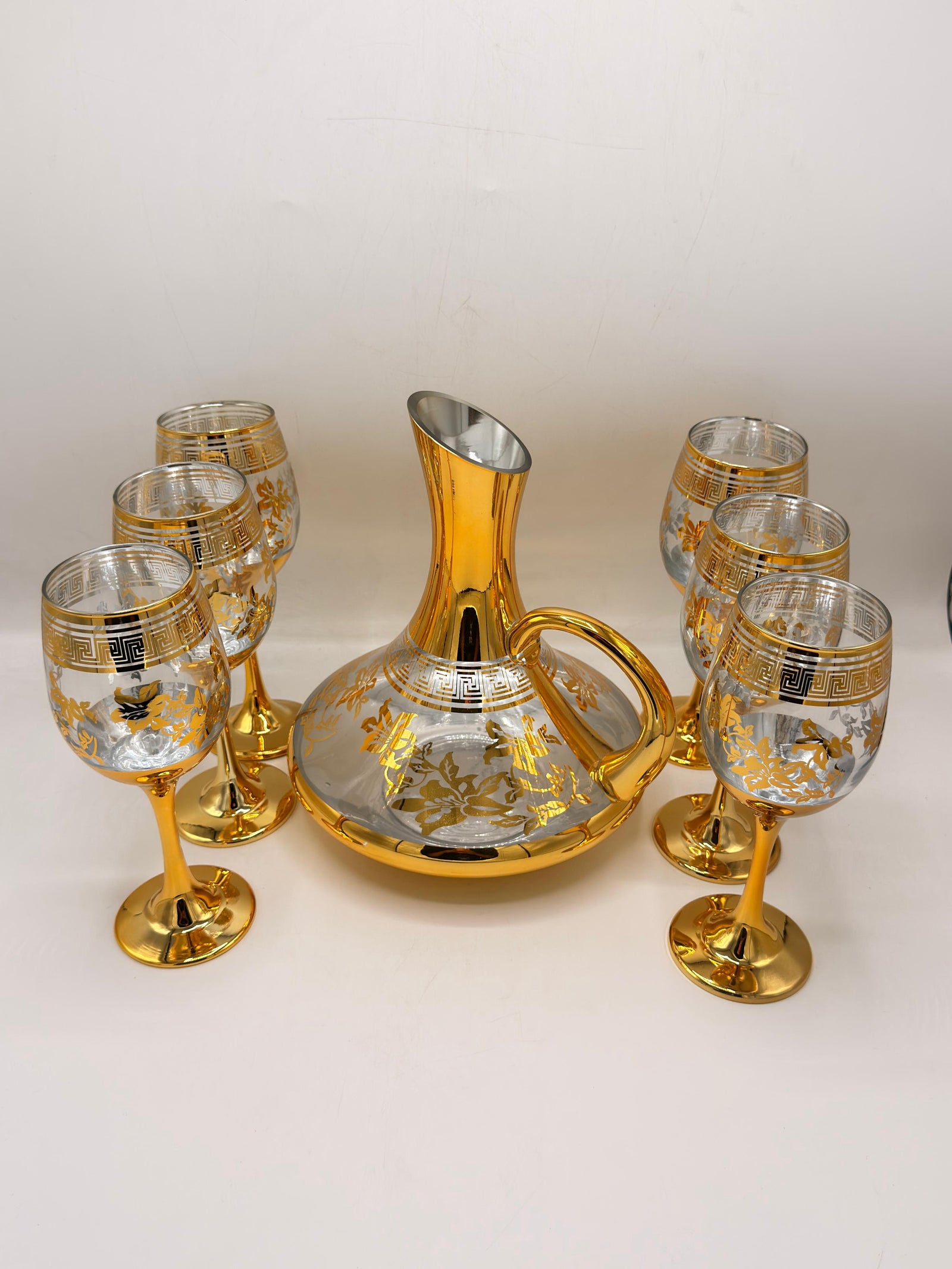 Royal gold decanter and goblets